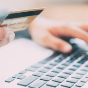 Man making online purchase with credit card 880x415